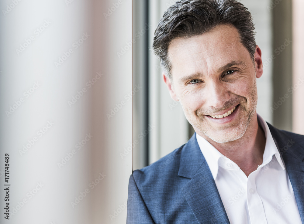 Portrait of smiling businessman with stubble