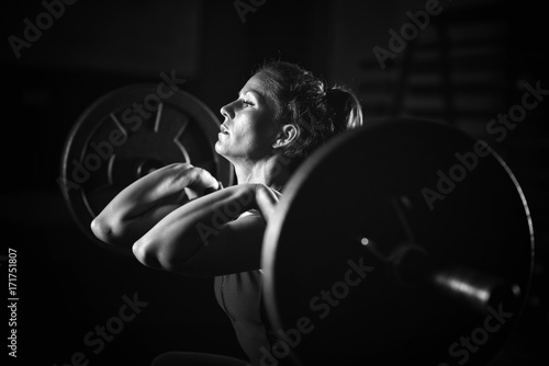 фотографія Woman weightlifting on training