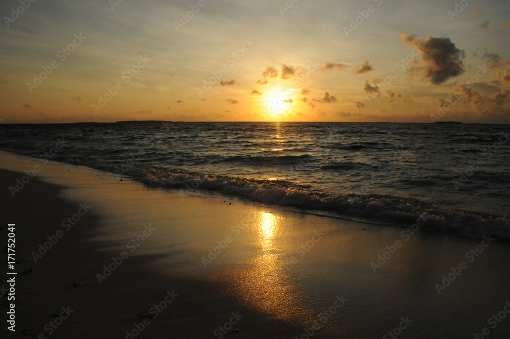 Beautiful Golden Sunset or Sunrise over the rippling Ocean