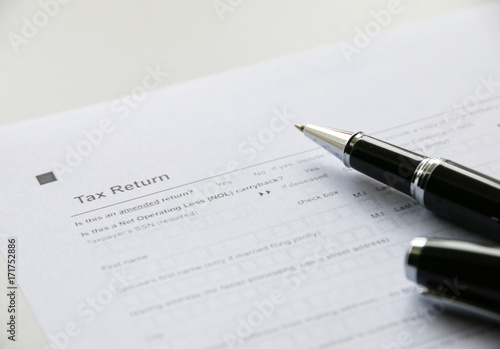 Tax Return 1040 paper on table