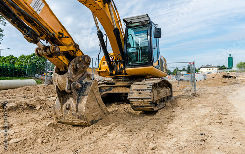 Excavator on road works photo