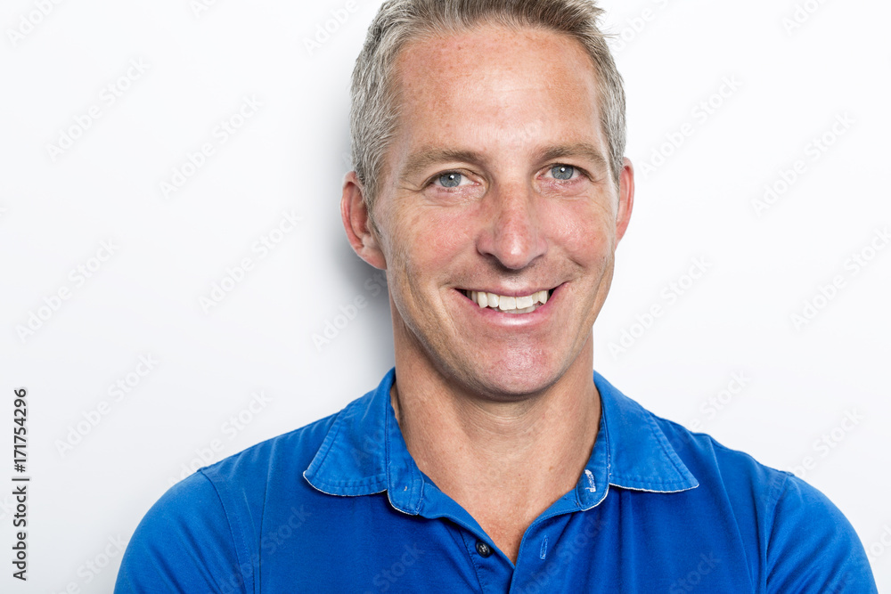 Obraz premium Portrait of confident mature man standing on white background