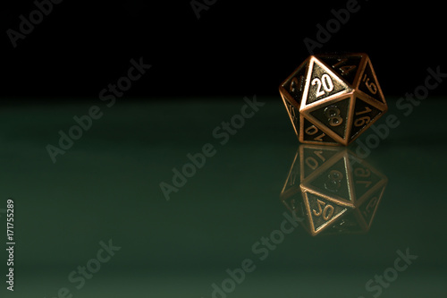 A polyhedral twenty sided die used for role playing games such as Dungeons & Dragons. photo
