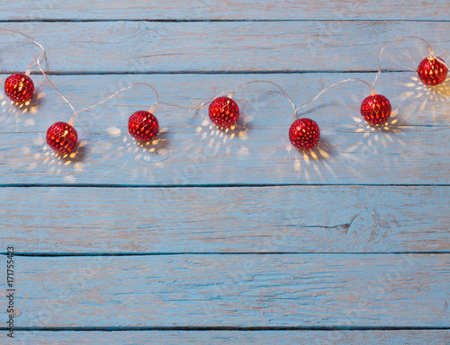 christmas lights on wooden background