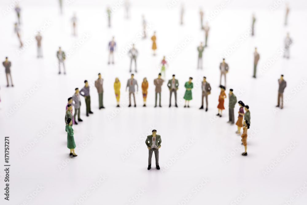 Group of miniature people over white background standing in line or circle. Group of miniature people over white background standing in line or circle.