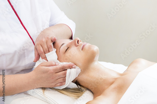 Process cosmetic mask of massage and facials in beauty salon 