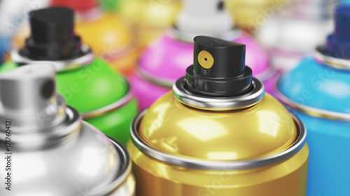 Colored spray paint cans closeup