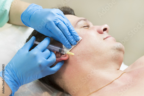 Man passes a course of mesotherapy clinic 