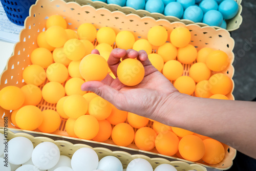 Hand holiding ping-pong balls. photo