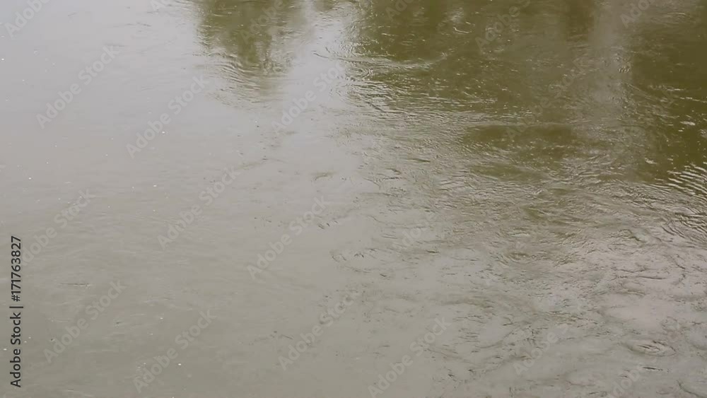 View from above. Rapid flow and bubbling of water, brown color in the river. View from above. Rapid flow and bubbling of water, brown color in the river.