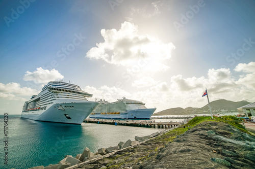 Two huge cruise ships are standing in the port of Philipsburg. Sint Maarten