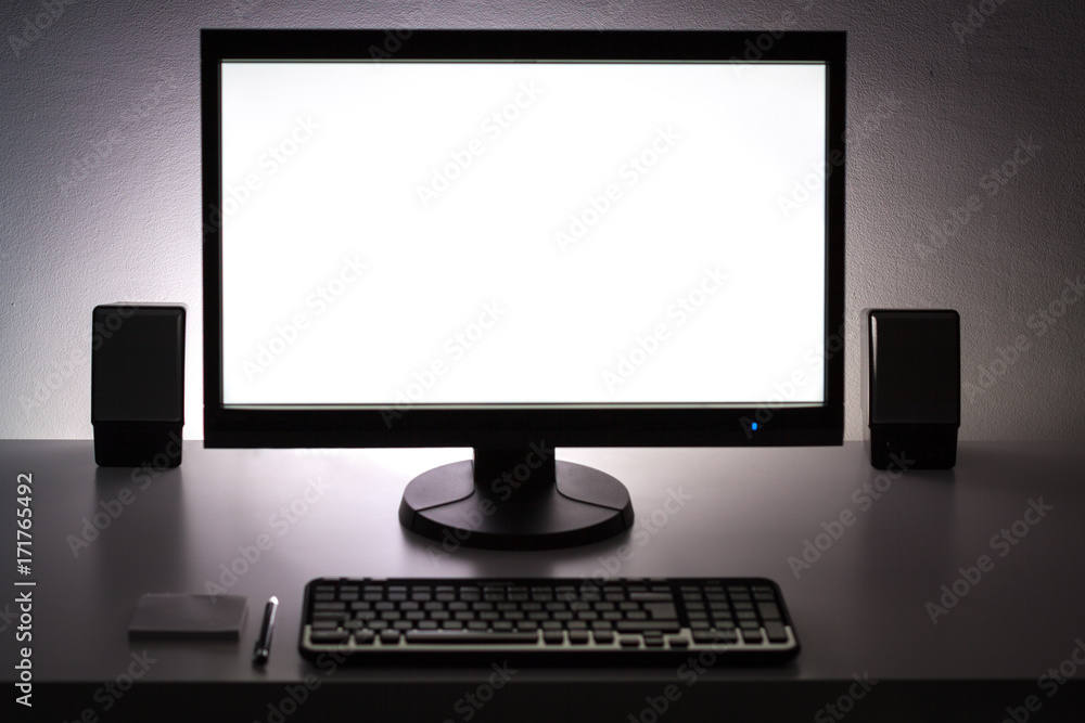 Blank white pc monitor on desktop in organized workplace. Blank white pc monitor on desktop in organized workplace.