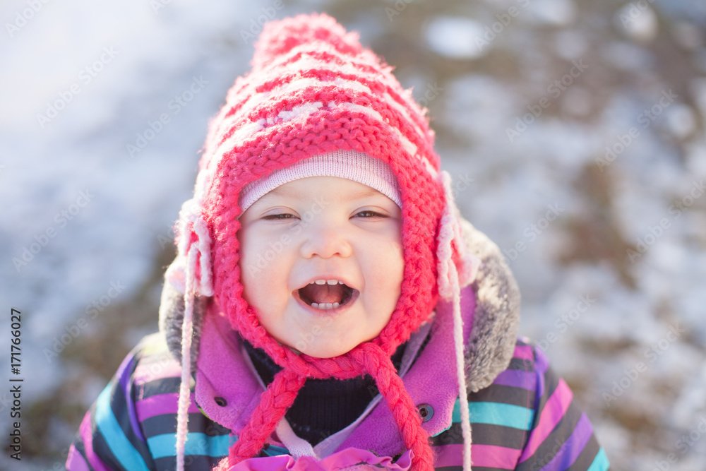 Little baby walking outdoors, winter day. Little baby walking outdoors, winter day.
