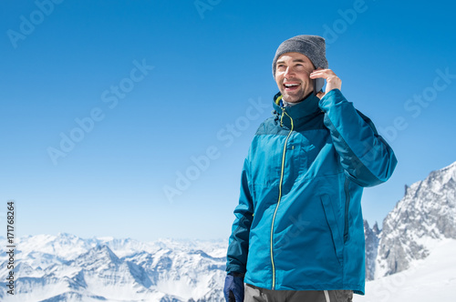 Man talking over phone in winter
