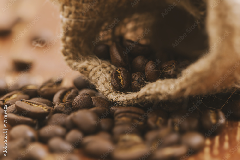 Coffee beans on a wooden table Coffee beans on a wooden table