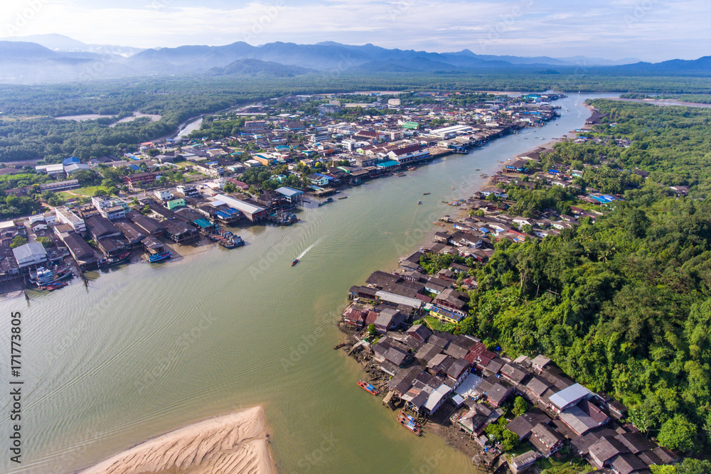 Aerial view of community on water edge around mount of river, Ranong Province, Thailand