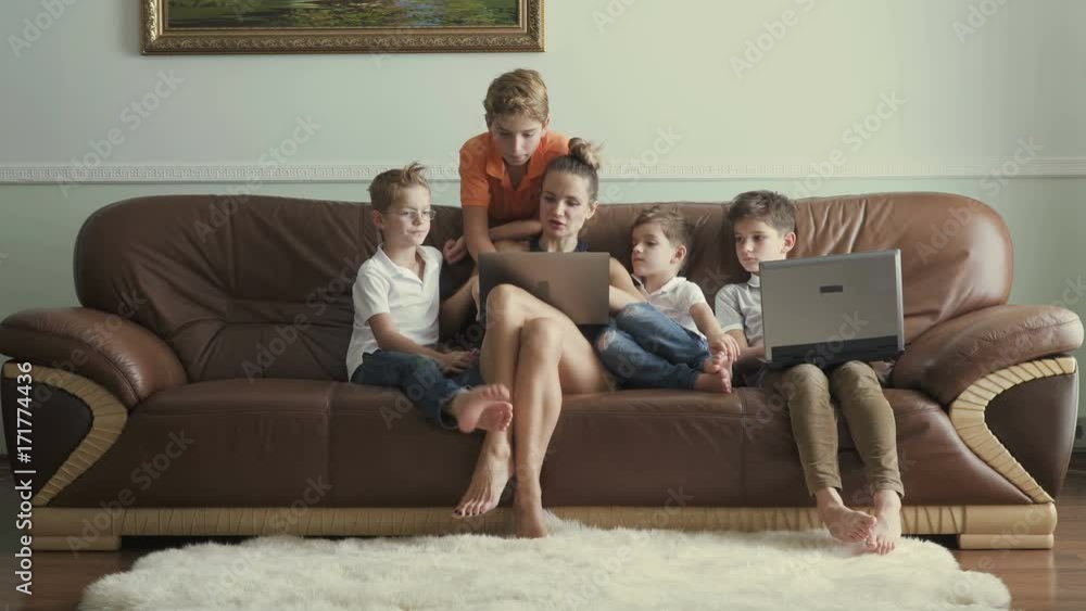 Mother with sons spends leisure time at home Mother with sons spends leisure time at home