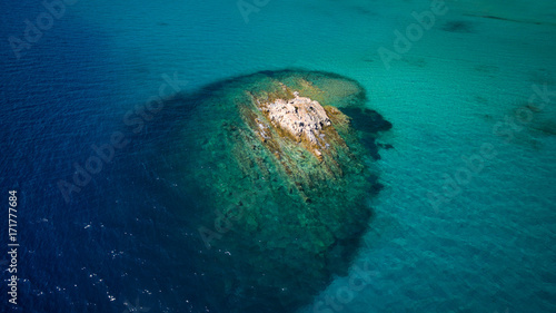 Little island in blue sea