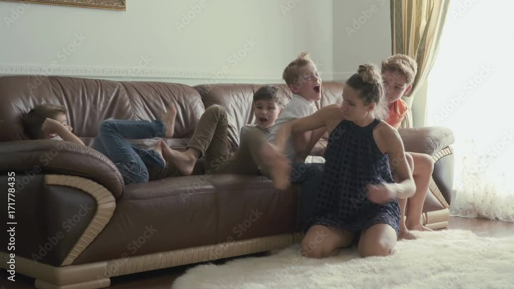 Young mother plays with sons at home Young mother plays with sons at home