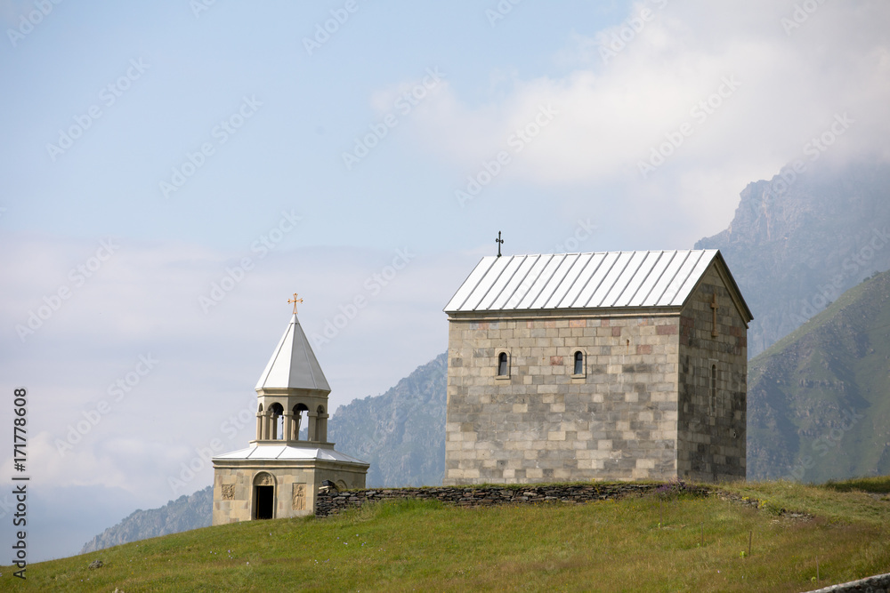 Georgia. Church in the mountains against the sky
