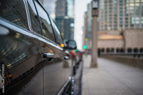 Passenger door handle of a black SUV 