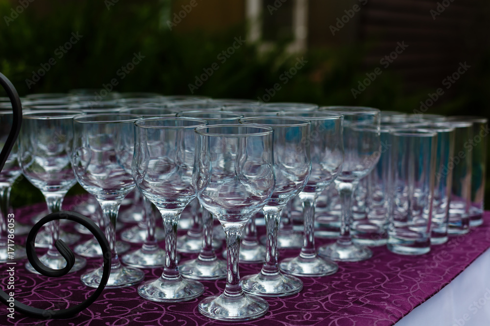 Beautiful champagne glasses defocused on buffet table in restaurant and blurred background Beautiful champagne glasses defocused on buffet table in restaurant and blurred background