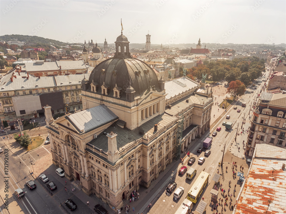 Opera from above, drone view cityscape, Lvov Ukraine, ukrainian flag on the top at sunset, aerial