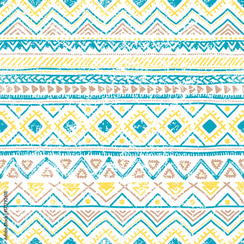 Seamless ethnic pattern. Vintage geometric ornament. Grunge texture. White, blue and yellow colors. Handmade. Bohemian print for textiles.