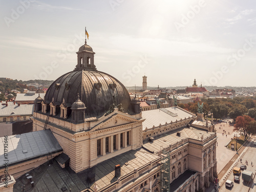 Opera from above, drone view cityscape, Lvov Ukraine, ukrainian flag on the top at sunset, aerial photo