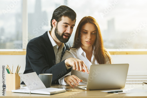 European man and woman working together