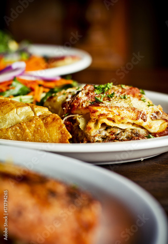 restaurant lasagna with bread