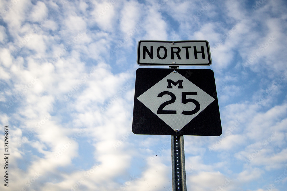 Northbound M 25 In Michigan. Roadside sign for popular M 25 along the Lake Huron coast. The highway travels through the beach towns of Lexington, Port Sanilac, Harbor Beach, Caseville, and Pt. Austin Northbound M 25 In Michigan. Roadside sign for popular M 25 along the Lake Huron coast. The highway travels through the beach towns of Lexington, Port Sanilac, Harbor Beach, Caseville, and Pt. Austin