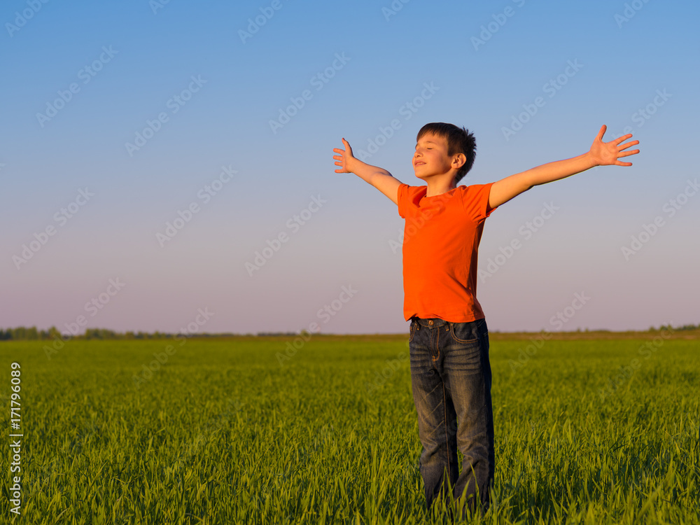 Happy person in the nature with raised arms Happy person in the nature with raised arms