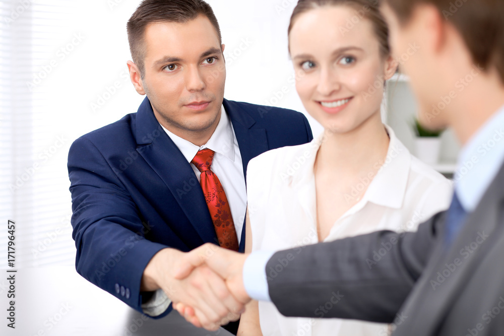 Two business man shaking hands to each other finishing up the meeting Two business man shaking hands to each other finishing up the meeting