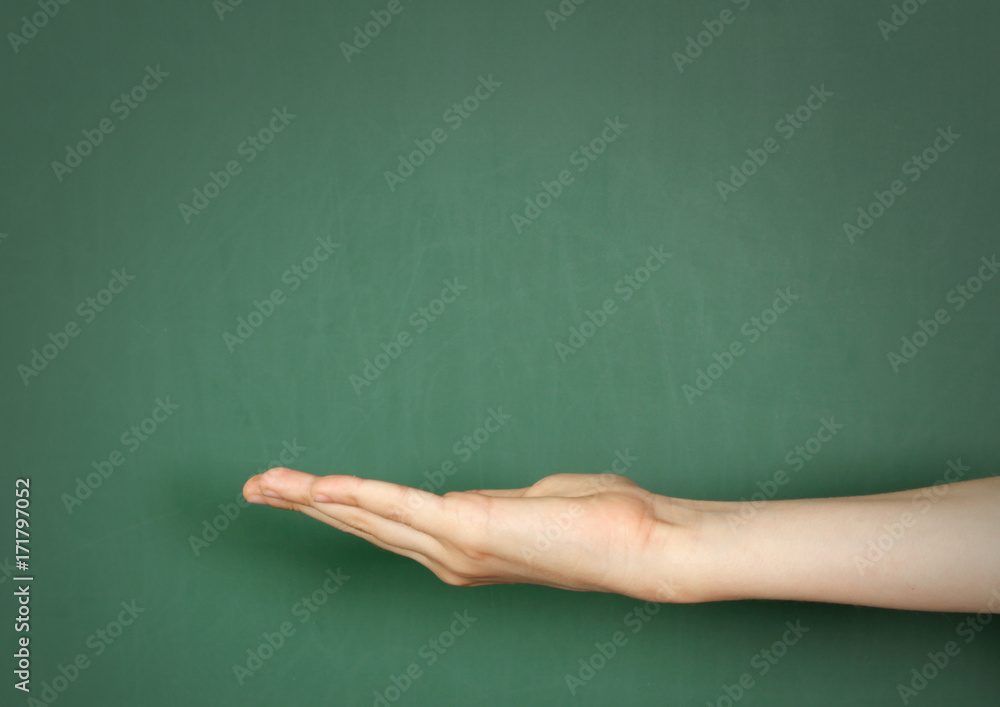 hand near empty school blackboard, copy space hand near empty school blackboard, copy space