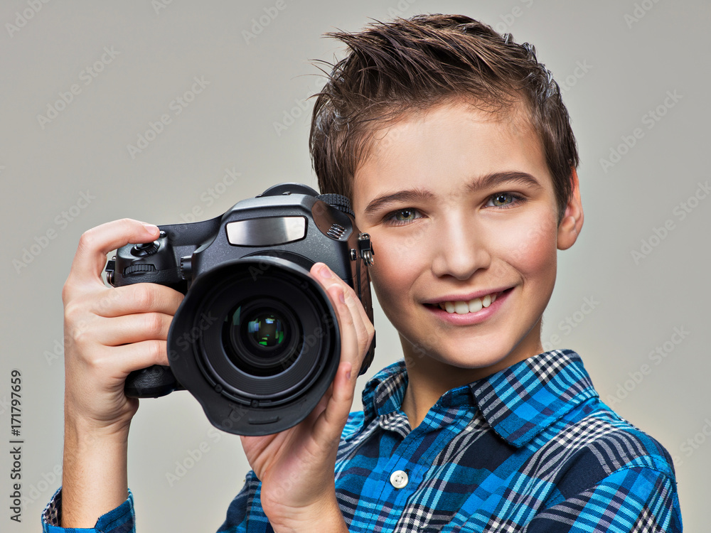 Boy with photo camera taking pictures. Boy with photo camera taking pictures.