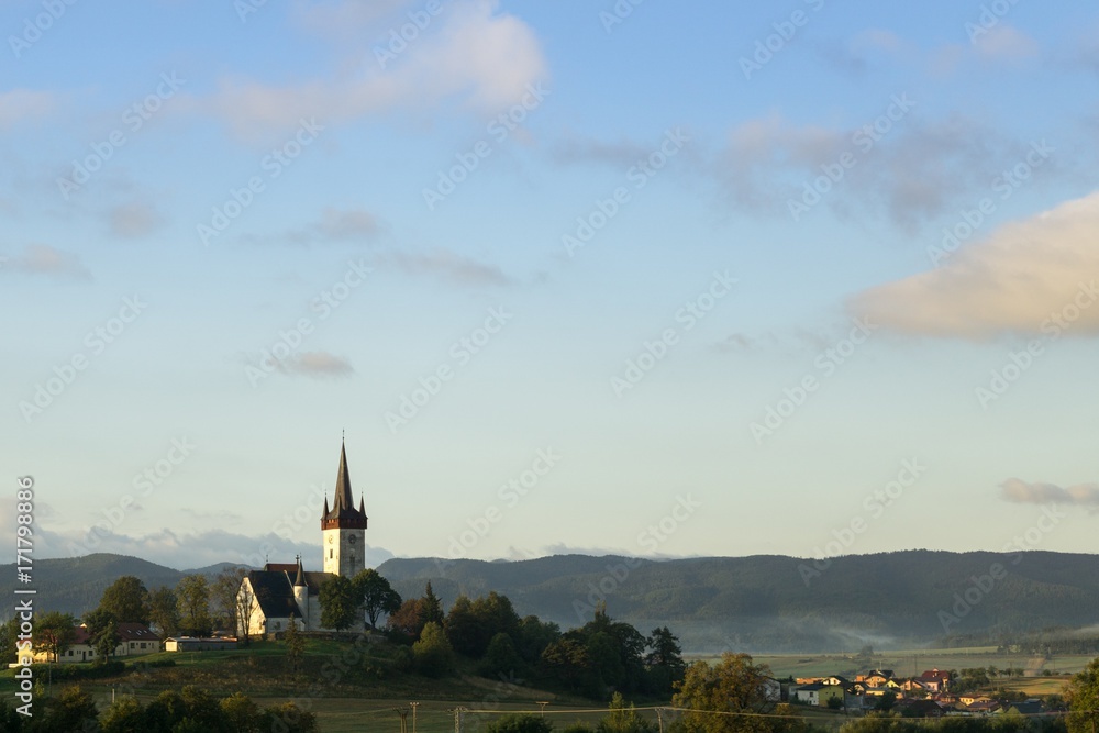 Fototapeta premium Misty morning sunrise on the road. Slovakia