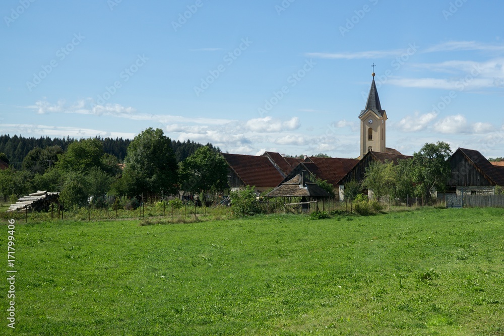 Town, green meadow and hills during sunny and cloudy afternoon. Slovakia Town, green meadow and hills during sunny and cloudy afternoon. Slovakia