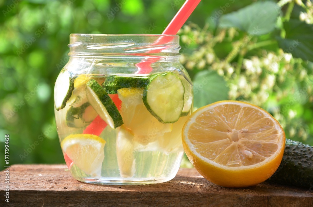 Infused detox water with cucumber, lemon, ginger and mint for diet healthy eating and weight loss with. Selective focus Infused detox water with cucumber, lemon, ginger and mint for diet healthy eating and weight loss with. Selective focus