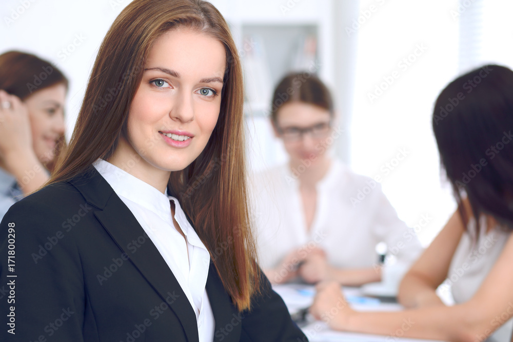 Beautiful business woman on the background of business people. Start up team Beautiful business woman on the background of business people. Start up team