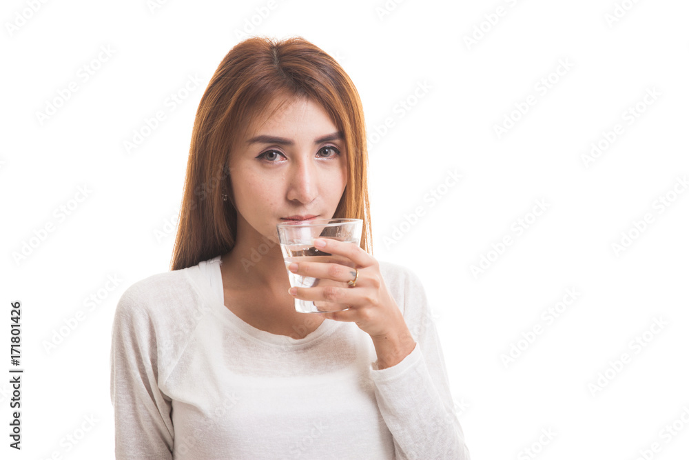 Young Asian woman with a glass of drinking water. Young Asian woman with a glass of drinking water.