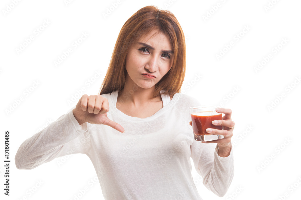 Asian woman thumbs down hate tomato juice. Asian woman thumbs down hate tomato juice.