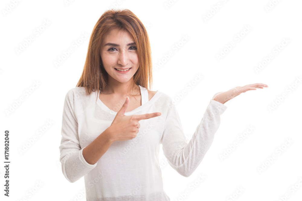 Beautiful young Asian woman point to palm hand.