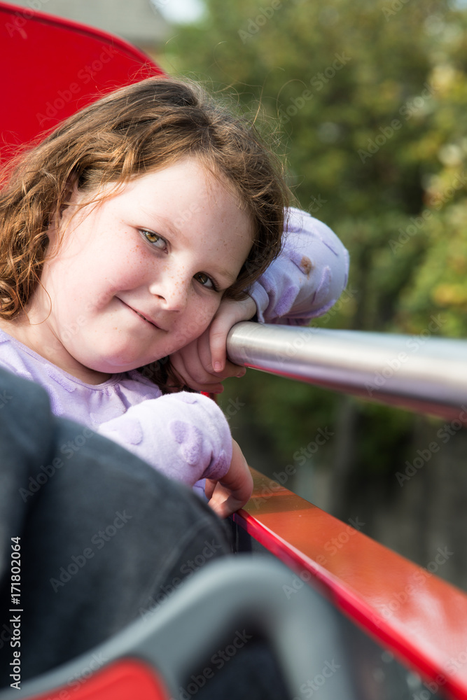 Young little girl portrait looking and smiling at the camera. Young little girl portrait looking and smiling at the camera.
