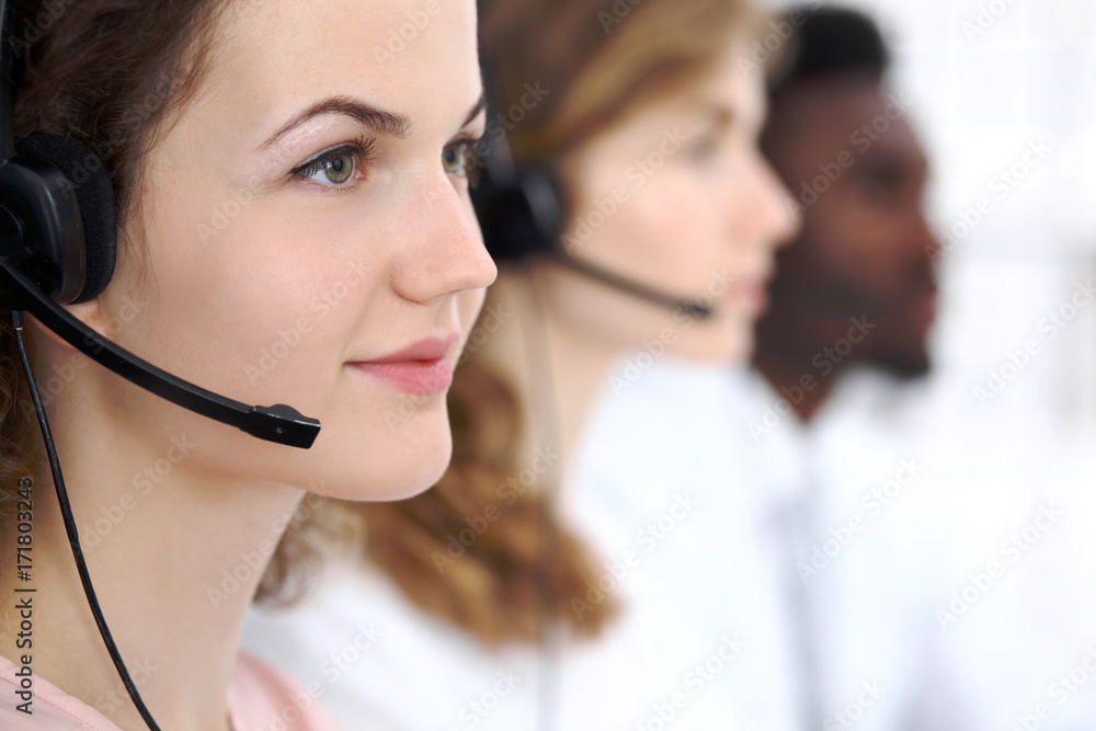 Call center operator.Young beautiful business woman in headset Call center operator.Young beautiful business woman in headset