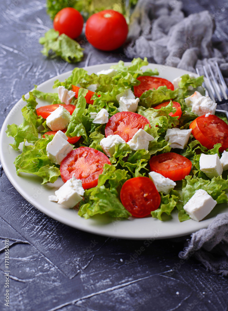 Healthy salad with tomato and feta cheese Healthy salad with tomato and feta cheese