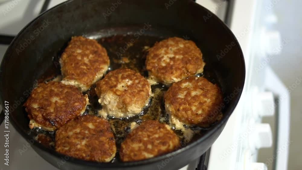 meat patties are fried in a frying pan. Slow motion meat patties are fried in a frying pan. Slow motion