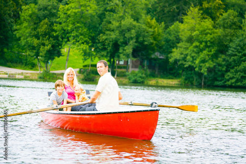 Family Enjoying A Boat Trip