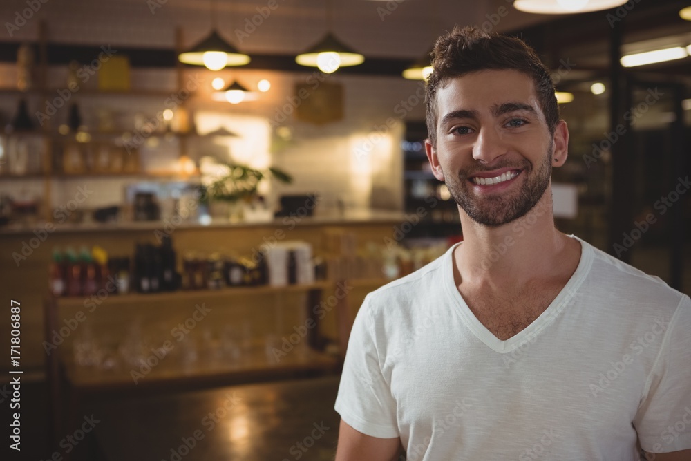 Portrait of smiling waiter in cafe Portrait of smiling waiter in cafe