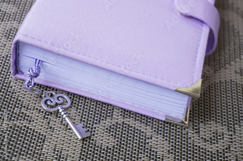 Handmade violet personal planner, notebook with stitched cover, decorated with silver frame, corners and bookmark with a key
